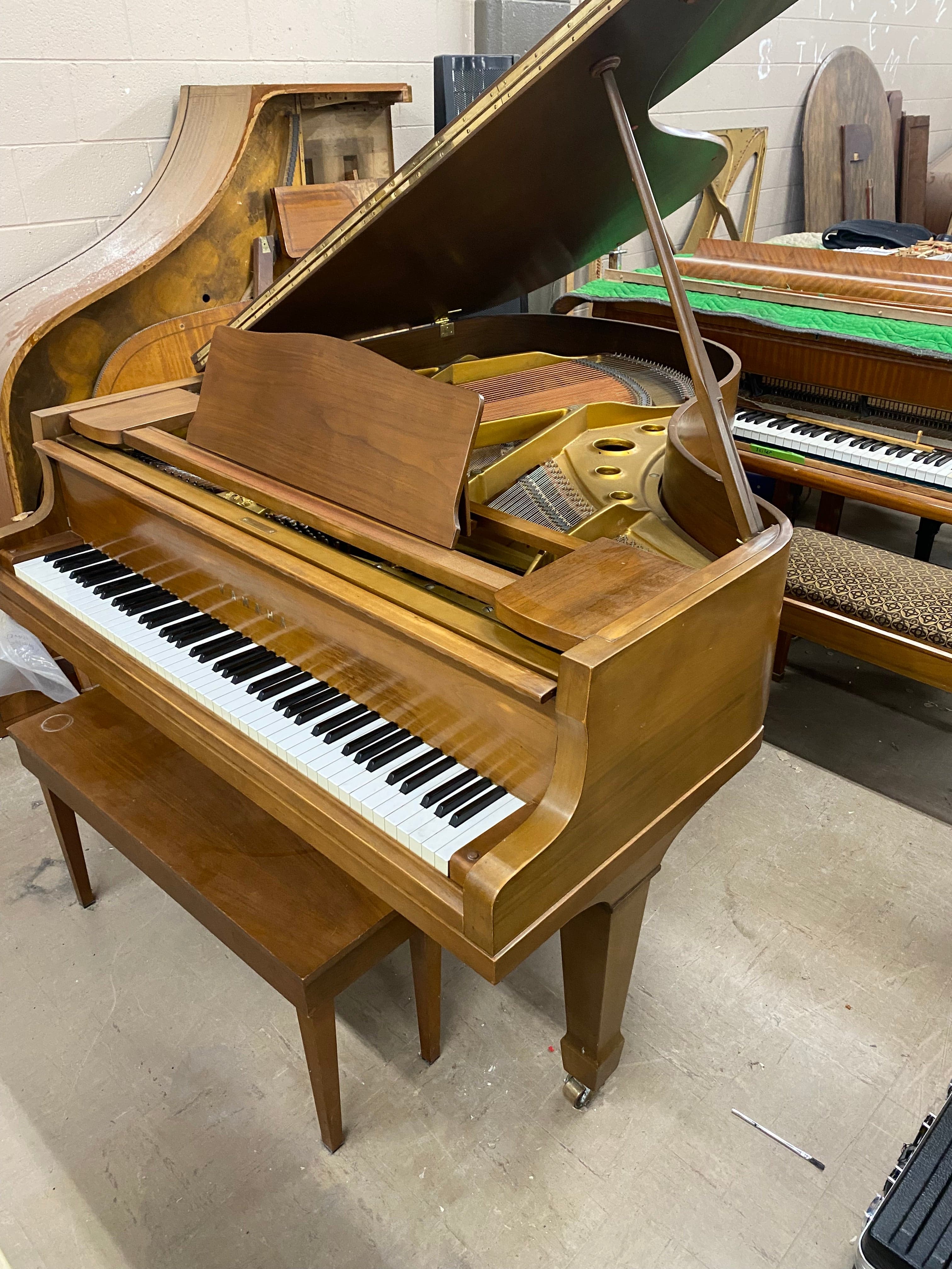 Yamaha 5’7” G2 grand in satin walnut.